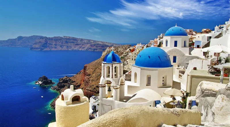 Blue-domed churches and the caldera at Oia, Santorini